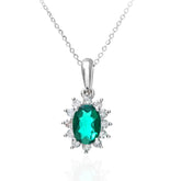 0.6ct Oval Emerald & 0.25ct Diamond Cluster Pendant – 9ct White Gold Necklace